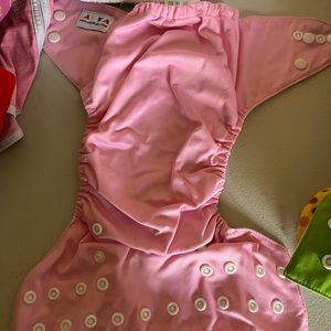 Cloth diapers and liners, one size adjustable. 10 diapers, 12 liners